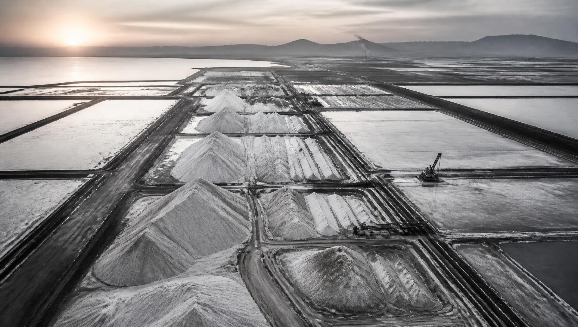 Aerial view of Egyptian solar salt evaporation fields at dawn